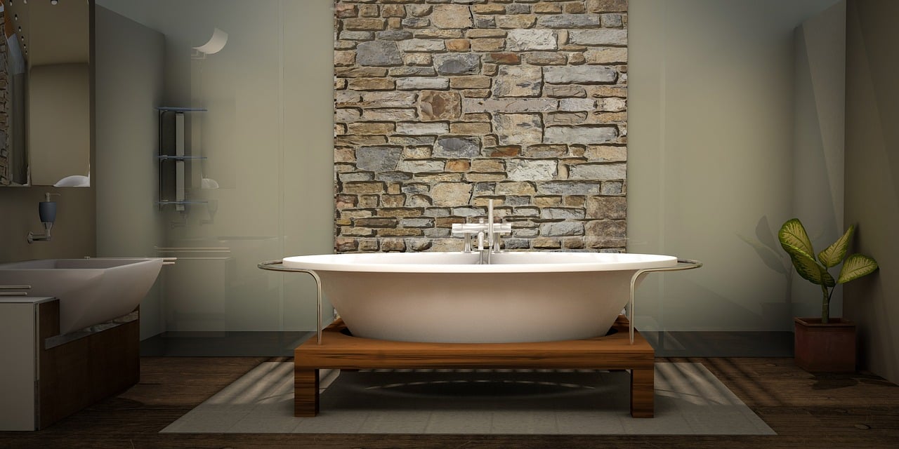 Modern bathroom with stone accent wall and natural elements