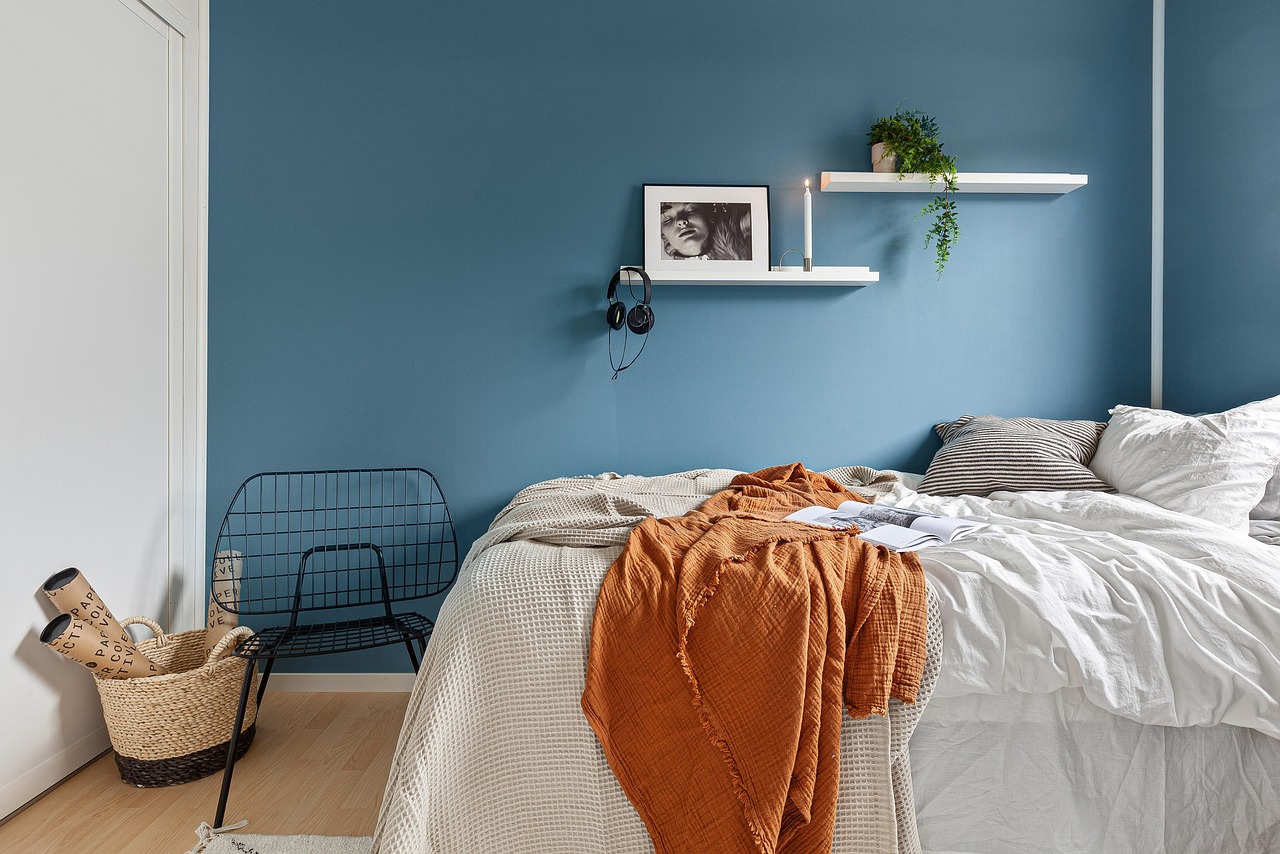 Modern bedroom with blue accent wall